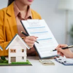 Asian businesswoman discussing home purchase contract
