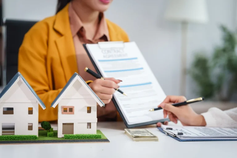 Asian businesswoman discussing home purchase contract